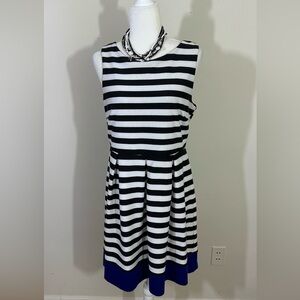 Stitch between sz L.dress Fit & flair Black stripe with a royal band along hem.